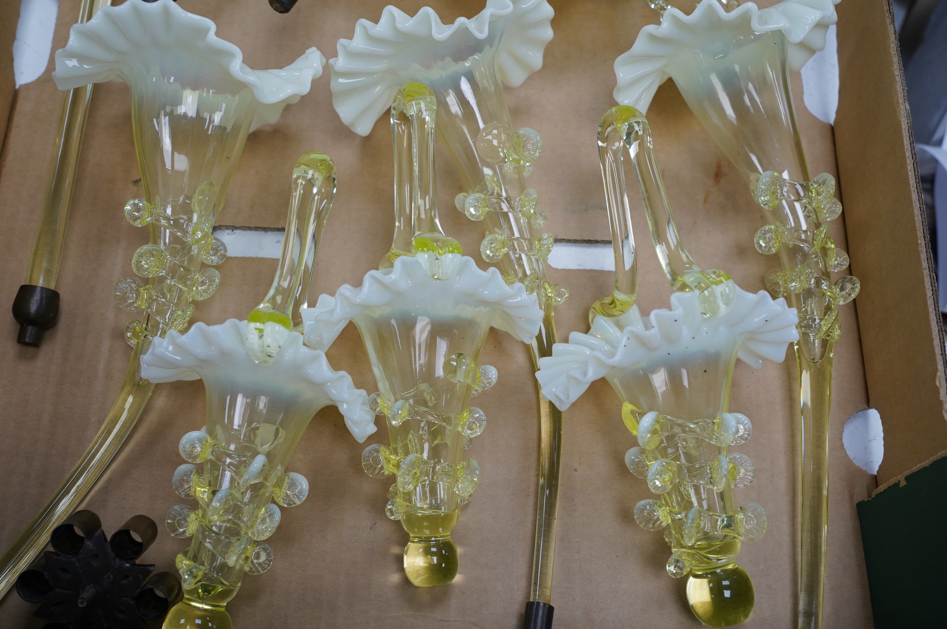 An ornate Vaseline glass epergne. Condition - base of main stem needs re gluing, all branches, trumpets and baskets good